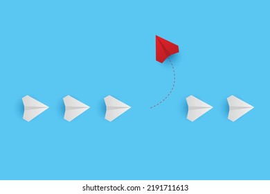 Business creative idea minimal concept. Creative paper planes on blue background. Red airplane changing direction. New idea, change, trend, courage, creative solution, innovation and unique concept.