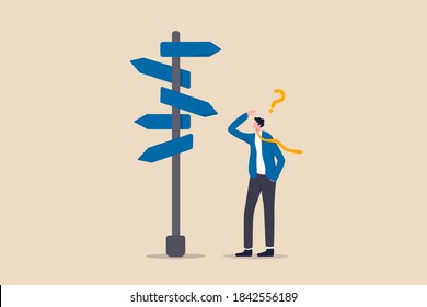 Business decision making, career path, work direction or choose the right way to success concept, confusing businessman looking at multiple road sign with question mark and thinking which way to go.