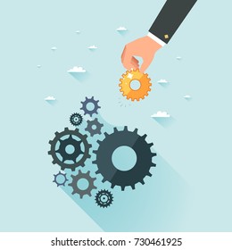 Business development concept. Businessman hand putting gold gear to cogwheel mechanism. Cogwheels as symbol of successful business. Vector illustration.