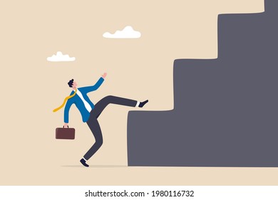 Business difficulty and challenge to overcome to achieve success goal, big step for career or adversity concept, businessman trying hard with full effort to climb up big step ladder or stairway.