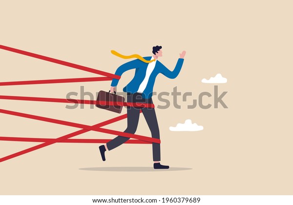 Business\
difficulty or struggle with career obstacle, limitation and trap or\
challenge to overcome to success concept, businessman tied up with\
red tape trying to run away with full\
effort.