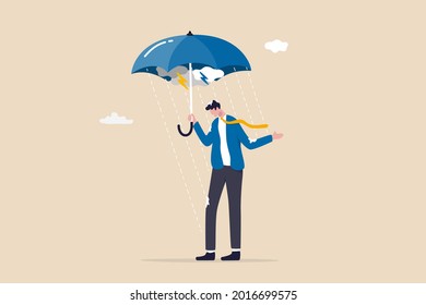 Business disaster or crisis, too many problems and failure, April fool or depression and mental health concept, soak businessman standing wet under fail umbrella in raining day.