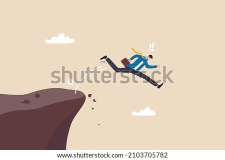 Business dumb, mistake, silly or self sabotage idea, bad decision in risky situation causing business failure concept, dumb thoughtless businessman jump off the cliff killing himself.