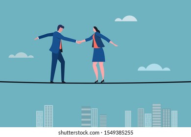 Business executives shaking hands on a tight rope. Concept for making deal with risks and challenges