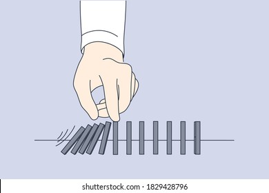 Business, game, finance, crisis, stop, management, leadership concept. Businessman leader hand pushing falling wooden blocks bricks placed on table. Playing domino stopping financial crisis banruptcy.