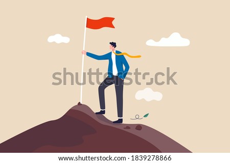 Business goal achievement, success career development or motivation and work or project accomplishment concept, confidence businessman standing proudly with victory flag on high mountain peak up hill.