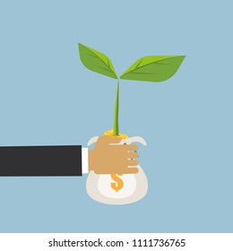Business hand hold money coin bag with green leaf, investment growth up concept.