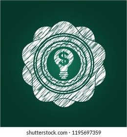 business idea icon inside chalk emblem written on a blackboard