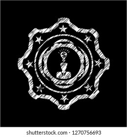 business idea icon inside chalkboard emblem on black board