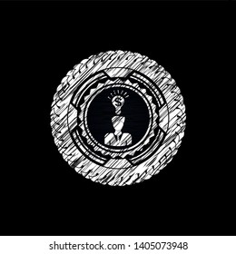 business idea icon inside chalkboard emblem written on a blackboard