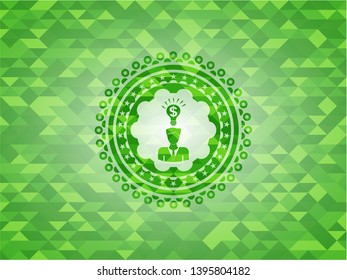 business idea icon inside green emblem with mosaic background