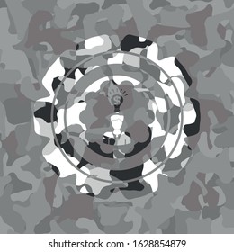 business idea icon inside grey camouflage texture