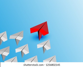 Business leadership concept with RED paper plane leading among white