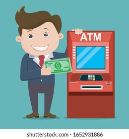 Business man with ATM teller machine. Financial transactions using ATM