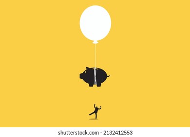 Business man celebrating in piggy bank balloon. business and savings concept