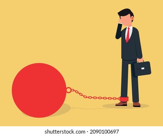 Business man chained to his big heavy debt weight.businessman corporate slavery concept.