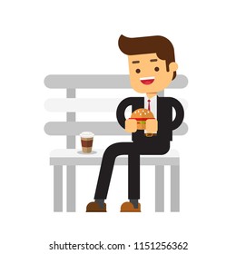 Business man eating hamburger and coffee