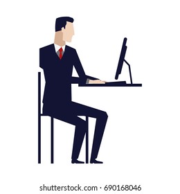 business man entrepreneur in a suit working on a laptop computer at his office desk