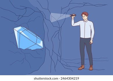 Business man found treasure or diamond inside cave, symbolizing reward for courage and ambition. White-collar guy with flashlight in hands does not see treasure because of thin partition