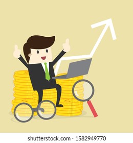 Business man with golden coin and laptop increase graph.investment concept.