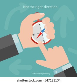 business man hands with compass.the concept of choosing the correct direction in the Affairs of.not the right decision