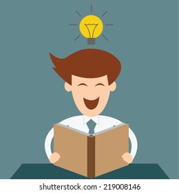 Business man having a great idea while reading a book