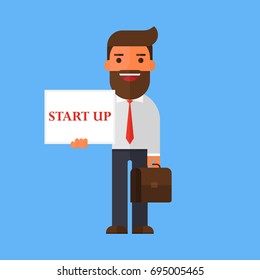 Business man holding notepad with a text 'startup'