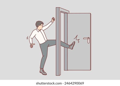 Business man kicks door bursting into office of competitors, violated business ethics. Guy, company manager, breaks down door, demonstrating willingness to do anything to achieve goal.