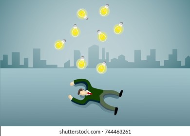 business man lie down on the floor with idea light bulb.