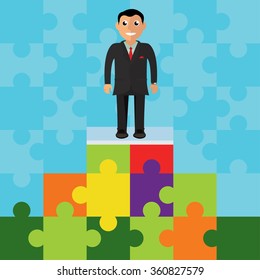 Business man on a puzzle pyramid
