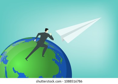 business man running on blue planet globe leading by paper plane