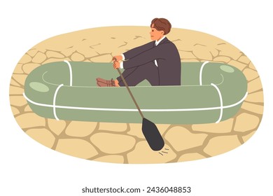 Business man sails through desert on inflatable boat, showing unprofessionalism and lack of skill in handling crisis situations. Concept of crisis disrupting entrepreneur plans to achieve success