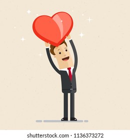 Business man showing a big red heart