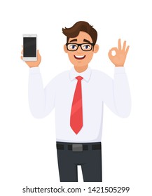Business man showing new brand, latest smartphone. Man holding cell, mobile phone and gesturing/making okay, OK sign with hand fingers. Modern lifestyle, digital technology device gadget in cartoon.