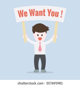 Business man showing a sign board with massage we want you on white board
