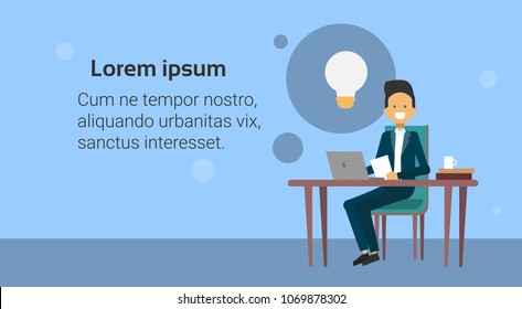 Business Man Sit At Office Desk Working On Laptop Computer At New Idea For Startup With Light Bubble Icon