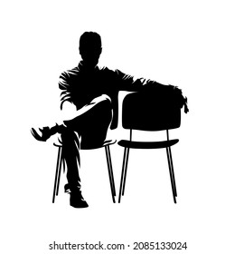 Business man sitting next to empty chair, isolated vector sihouette, front view