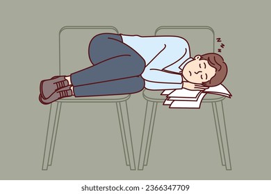 Business man sleeps on office chairs due to professional burnout and overwork that caused severe fatigue. Guy in business clothes sleeping at work after defaulting mortgage payment and losing home