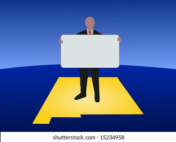 business man standing on map of New Mexico with blank sign