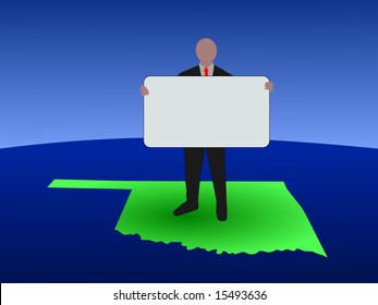 business man standing on map of Oklahoma with blank sign