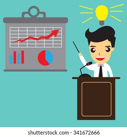 Business man standing pointing at chart and presentation.