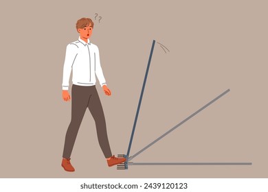 Business man steps on rake, risking injury, for concept of bankruptcy due to mistake. Stupid guy makes mistake, needing to improve intellectual and professional knowledge of problem solving