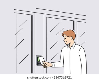 Business man uses key card for open electronic lock on door and gain access to office space. Guy enters buildings by sending key card to device to identify visitors and ensure security