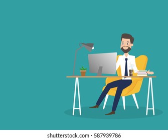 Business man working on computer at office desk.