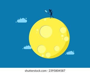 Business market analysis. Businesswoman uses a magnifying glass to examine the moon or planets