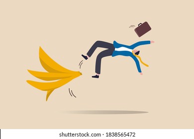 Business mistake or accident, insurance, disaster suddenly happened without warning or risk and danger in investment concept, businessman running and slipping with big banana peels on the ground.