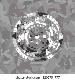 business network icon inside grey camouflaged emblem