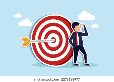 Business objective, purpose or target, goal and resolution to aim for success, aspiration and motivation to achieve goal concept, confident businessman stand with arrow hit bullseye on archery target