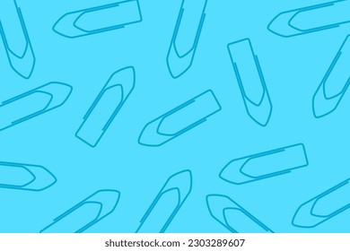 Business office pattern. A pile of blue paper clips scattered on a blue background