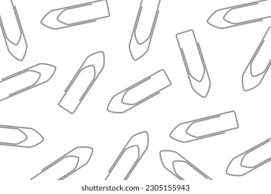 Business office pattern. A pile of gray paper clips scattered on a white background